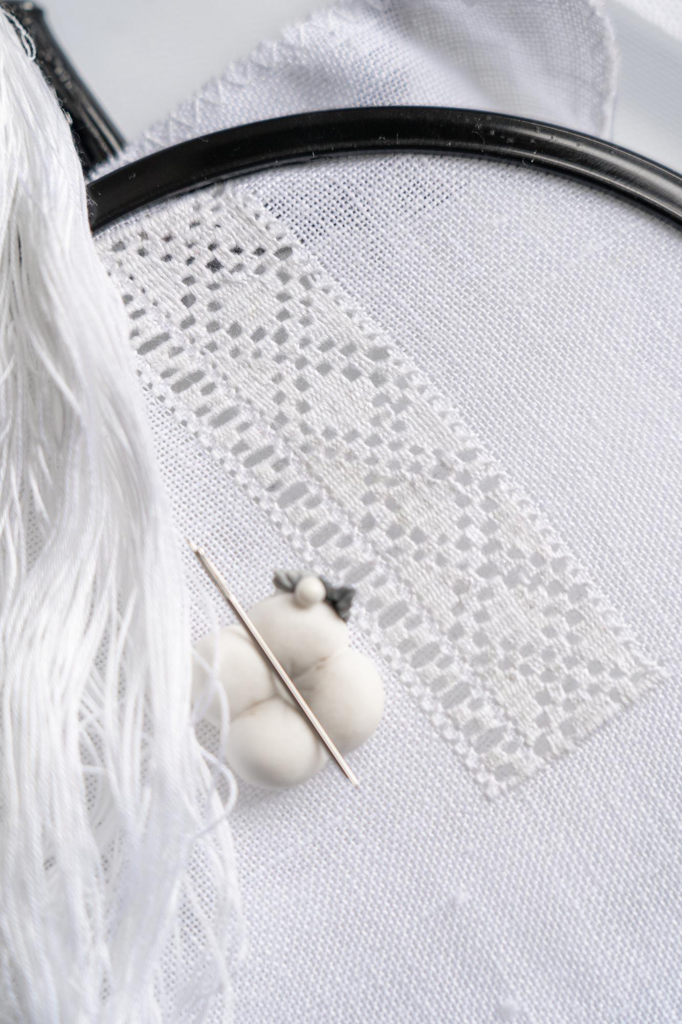 Delicate hand embroidery on linen garment